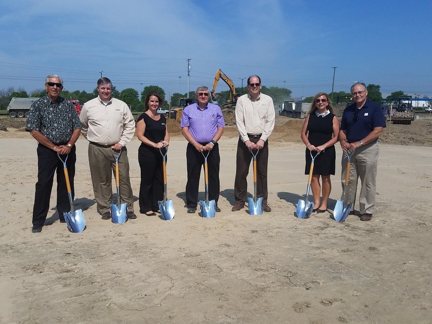 Bank Employees Holding Shovels